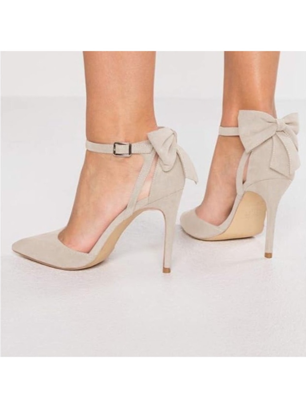 Bow slingback stiletto pumps